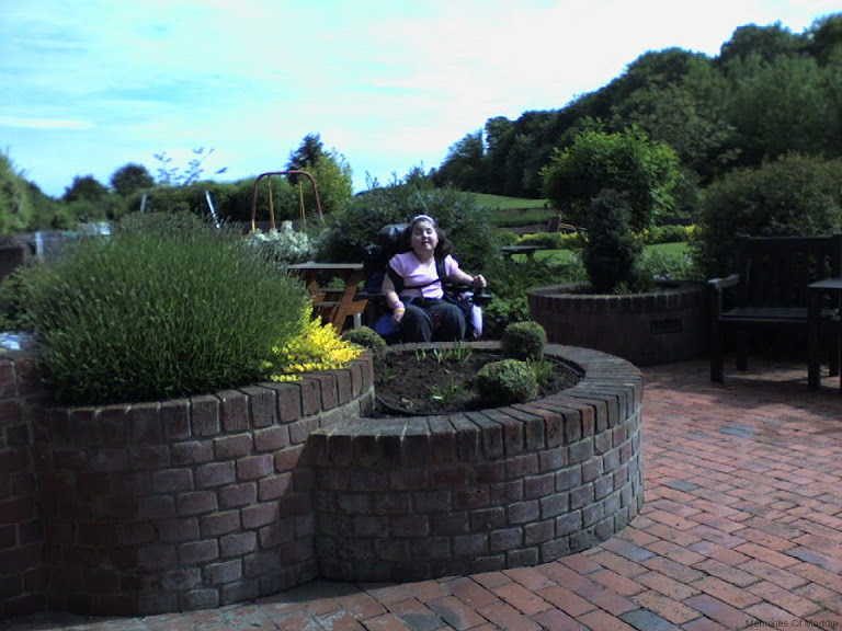 8-zooming-around-the-garden-at-naomi-house.jpg