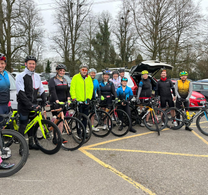 Cyclist lined up on bikes in car park
